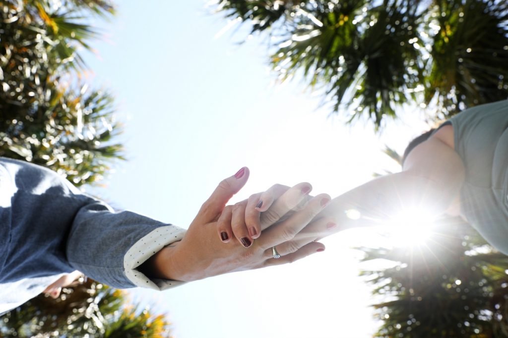 Two hands reaching out to each other. 